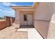 Inviting front porch entrance with gravel landscaping, brick trim, and stucco walls at 8944 W Rochelle Ave, Las Vegas, NV 89147