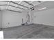 Spacious garage features concrete flooring and white walls, ready for customization at 8944 W Rochelle Ave, Las Vegas, NV 89147