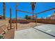 Backyard with swing and concrete patio, set against a clear blue sky and desert landscape at 901 Carnival Ave, Las Vegas, NV 89123