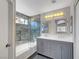 Beautiful bathroom boasts a double sink vanity, modern tile, and a shower-tub combo at 901 Carnival Ave, Las Vegas, NV 89123
