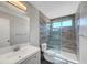 Newly remodeled bathroom with modern vanity, stylish tile, and frameless glass shower at 901 Carnival Ave, Las Vegas, NV 89123
