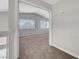 A bright bedroom features gray walls, neutral carpet, and a window with natural light at 901 Carnival Ave, Las Vegas, NV 89123