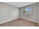 Bedroom featuring plush carpet and a window with blinds at 901 Carnival Ave, Las Vegas, NV 89123