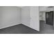 Bedroom with door to kitchen featuring neutral color and hard flooring at 901 Carnival Ave, Las Vegas, NV 89123