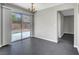 Dining room featuring backyard access, tiled floors, neutral walls, and modern lighting at 901 Carnival Ave, Las Vegas, NV 89123