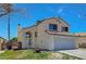 Charming two-story home featuring desert landscaping and a two-car garage, complete with a tile roof at 901 Carnival Ave, Las Vegas, NV 89123