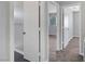 Neutral-colored hallway with doorways to the bath and bedrooms at 901 Carnival Ave, Las Vegas, NV 89123