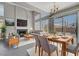 Bright, modern living room with large windows, a fireplace, and open access to a sliding glass door to the backyard at 901 Carnival Ave, Las Vegas, NV 89123