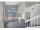 Spacious living room with high ceilings, fireplace, backyard access, and ample natural light at 901 Carnival Ave, Las Vegas, NV 89123