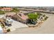 An aerial shot features solar panels, lush landscaping, large driveway, and RV parking at 9015 S Tenaya Way, Las Vegas, NV 89113