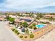 Aerial view of this property featuring a large lot with lush landscaping and a refreshing pool at 9015 S Tenaya Way, Las Vegas, NV 89113
