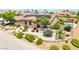 An aerial view of a home with pool, desert landscaping, tile roof, and solar panels at 9015 S Tenaya Way, Las Vegas, NV 89113