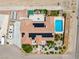 A birds-eye view showcases a home's solar panels, pool, outdoor amenities, and RV parking at 9015 S Tenaya Way, Las Vegas, NV 89113