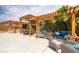 Lovely backyard with a pergola, outdoor seating, and grill area, offering a great space for entertaining at 9015 S Tenaya Way, Las Vegas, NV 89113