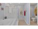 Modern bathroom with a glass shower, a soaking tub, and neutral paint at 9015 S Tenaya Way, Las Vegas, NV 89113