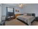 Comfortable bedroom with large window, ceiling fan, and neutral colors at 9015 S Tenaya Way, Las Vegas, NV 89113