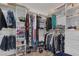 Well-organized walk-in closet with ample storage space for clothes, shoes, and accessories at 9015 S Tenaya Way, Las Vegas, NV 89113
