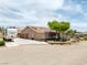 Gorgeous home with solar panels, lush landscaping, and a large driveway with RV parking at 9015 S Tenaya Way, Las Vegas, NV 89113
