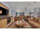 Spacious living room has comfortable seating with an entertainment center at 9015 S Tenaya Way, Las Vegas, NV 89113