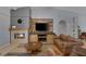 Cozy living room featuring a fireplace and entertainment center at 9015 S Tenaya Way, Las Vegas, NV 89113