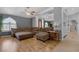 Bright living room with hardwood floors, a large sofa, and a window at 9015 S Tenaya Way, Las Vegas, NV 89113