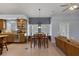 Open concept kitchen and living area with tile floors and natural lighting at 9015 S Tenaya Way, Las Vegas, NV 89113