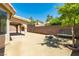 Large backyard featuring desert landscaping, a fire pit, and bench seating at 902 Possum Hill St, Henderson, NV 89014