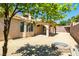 Spacious backyard featuring desert landscaping, a firepit, and covered patio at 902 Possum Hill St, Henderson, NV 89014