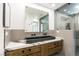 Modern bathroom features a vessel sink, marble countertops, and a glass-enclosed shower at 902 Possum Hill St, Henderson, NV 89014