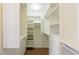 Walk-in closet with custom shelves and storage drawers at 902 Possum Hill St, Henderson, NV 89014
