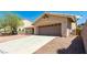 Charming single-story home featuring an attached two-car garage and low maintenance desert landscaping at 902 Possum Hill St, Henderson, NV 89014