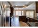 Modern kitchen featuring stainless steel appliances, dark cabinets, and granite countertops at 902 Possum Hill St, Henderson, NV 89014