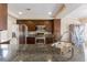 Kitchen with granite countertops, stainless steel appliances, and dark wood cabinetry at 902 Possum Hill St, Henderson, NV 89014