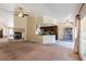 Expansive living area seamlessly connects to a modern kitchen with dark wood cabinets at 902 Possum Hill St, Henderson, NV 89014