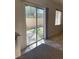 Kitchen sliding glass doors providing access to a well-maintained backyard at 908 Shining Rose Pl, Henderson, NV 89052