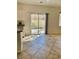 Kitchen sliding glass doors providing access to a well-maintained backyard at 908 Shining Rose Pl, Henderson, NV 89052
