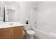 Bright bathroom featuring a shower over tub and a light wood vanity at 908 Shining Rose Pl, Henderson, NV 89052