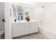 Clean bathroom featuring a shower over tub and a large mirror at 908 Shining Rose Pl, Henderson, NV 89052