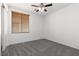 A clean bedroom featuring one window, plush carpet, and a closet at 908 Shining Rose Pl, Henderson, NV 89052