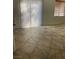 Open dining area with tiled flooring and a sliding glass door for natural light at 908 Shining Rose Pl, Henderson, NV 89052