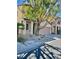 Street view of home featuring low maintenance landscaping and mature shade tree at 908 Shining Rose Pl, Henderson, NV 89052