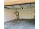 A clean and spacious two-car garage with water heater, and overhead lighting at 908 Shining Rose Pl, Henderson, NV 89052