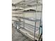 Garage storage featuring metal shelving units, providing ample organization at 908 Shining Rose Pl, Henderson, NV 89052