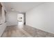 Open living area with tile and wood flooring, neutral paint, and a view into the kitchen at 908 Shining Rose Pl, Henderson, NV 89052