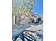 Street view of townhomes, featuring well-maintained landscaping, sidewalks, and street parking at 908 Shining Rose Pl, Henderson, NV 89052