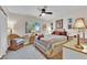 Comfortable bedroom with natural light, ceiling fan, and stylish decor at 9237 Quail Ridge Dr, Las Vegas, NV 89134