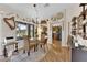 Bright dining room with backyard view, stylish decor, and hardwood floors at 9237 Quail Ridge Dr, Las Vegas, NV 89134
