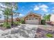 Well-maintained home with desert landscaping, a tile roof, and a two-car garage at 9237 Quail Ridge Dr, Las Vegas, NV 89134