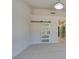 Spacious bedroom featuring neutral carpet, with a white sliding barn door at 9800 Rosamond Dr, Las Vegas, NV 89134