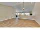 Spacious living room featuring vaulted ceilings, wood-look floors, neutral paint, and open floor plan at 9800 Rosamond Dr, Las Vegas, NV 89134
